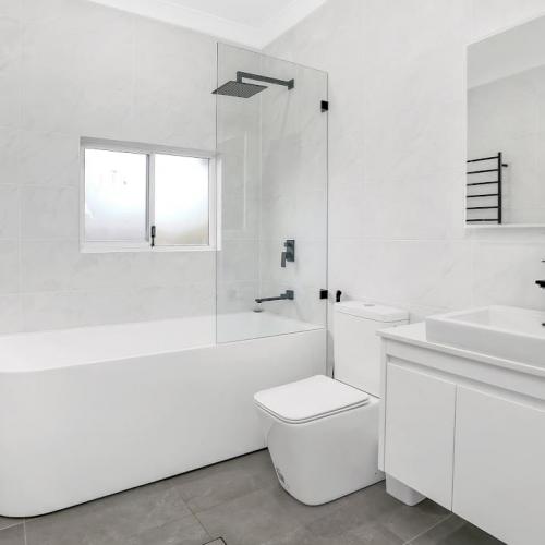 fully renovated bathroom in white