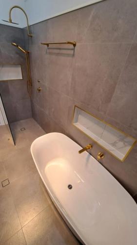 bathroom reno with gold fittings